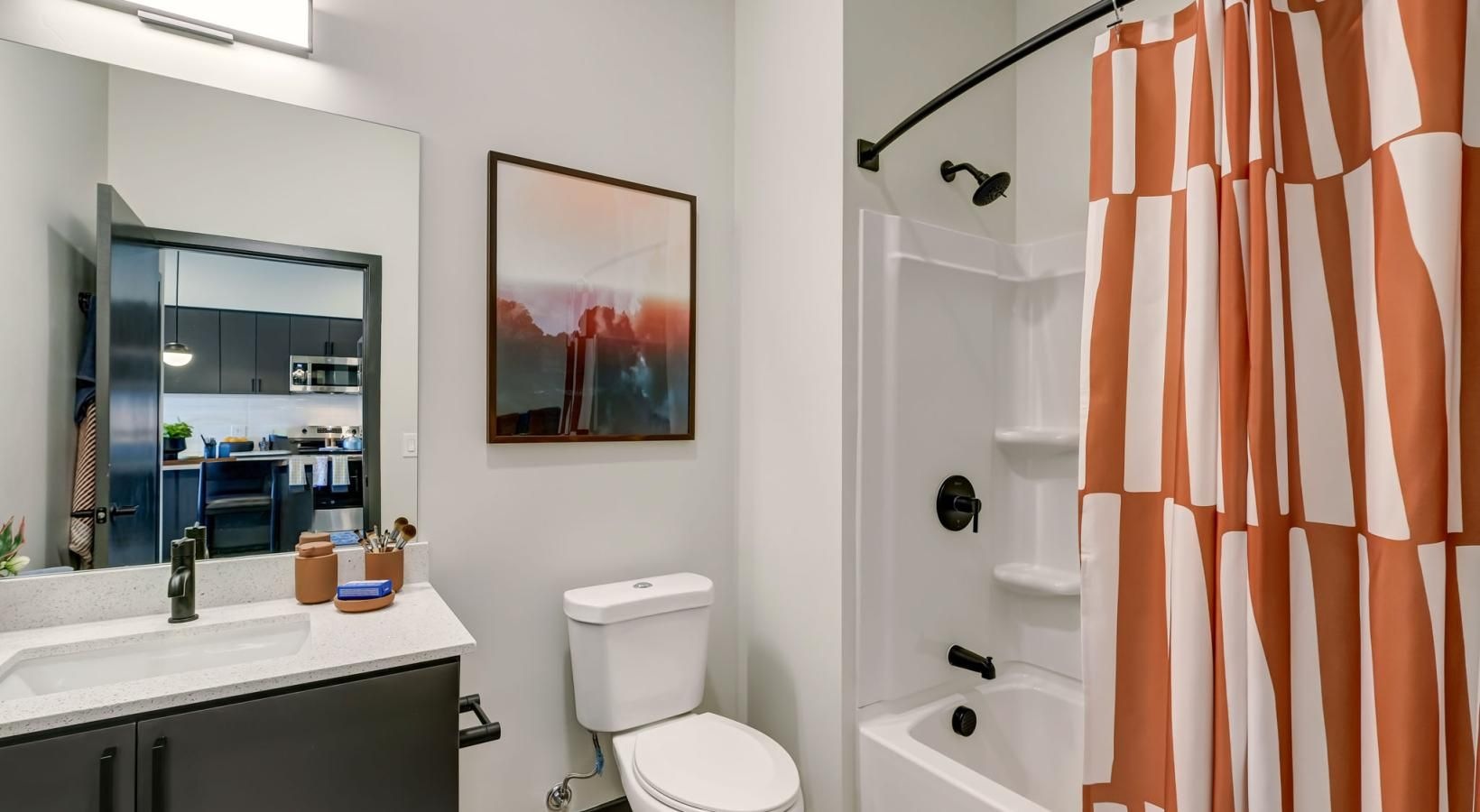 Spacious bathrooms with everything you need a bathroom with a red curtain