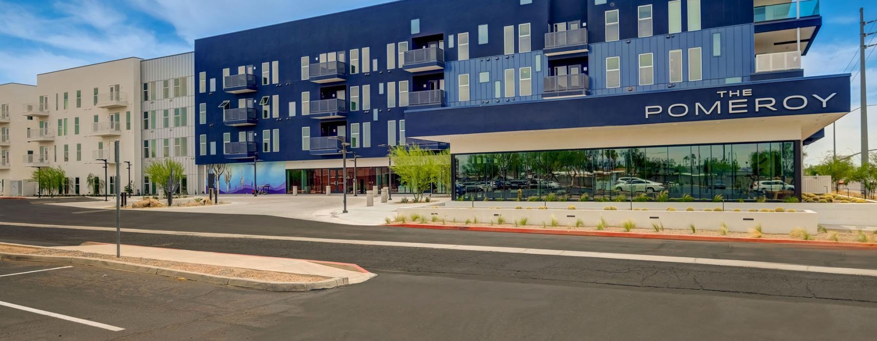 a large building with a parking lot