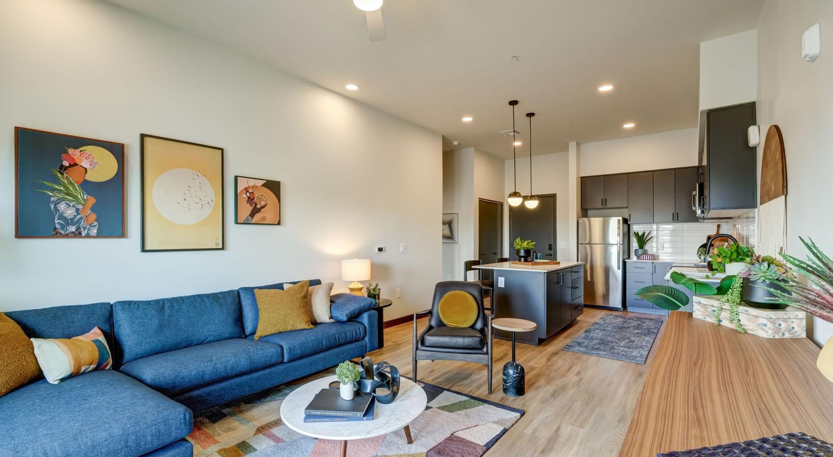 Spacious living areas to recline and recharge a living room with a blue couch