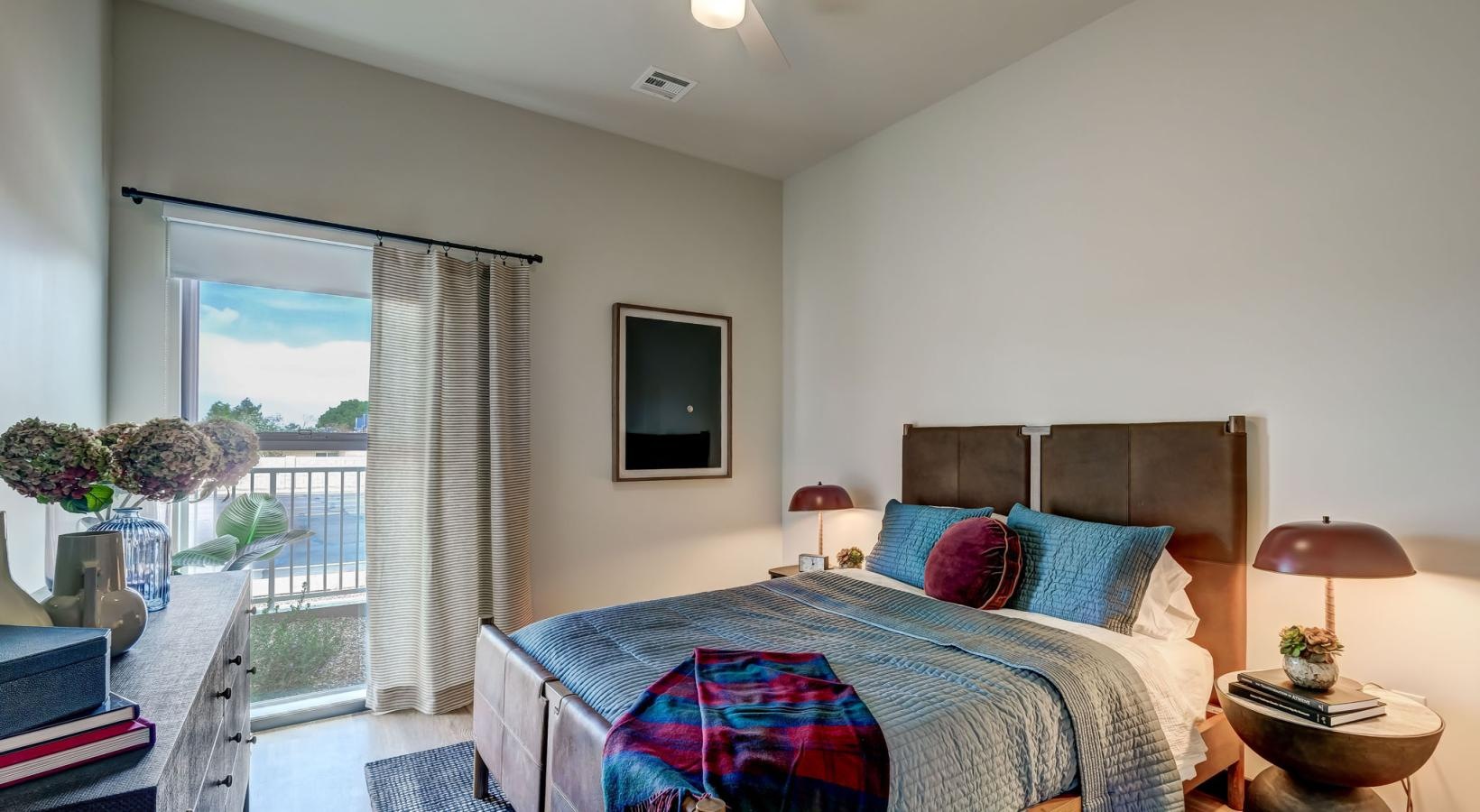 Relax and recharge in beautiful and spacious bedrooms a bedroom with a large window