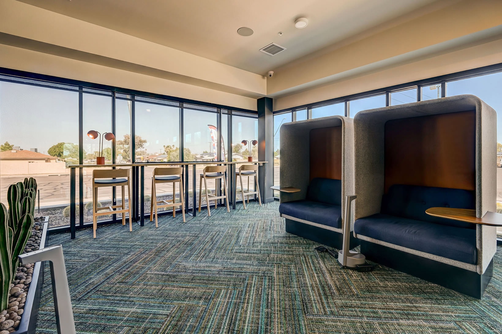 All the comforts of luxury living sitting booths in clubhouse