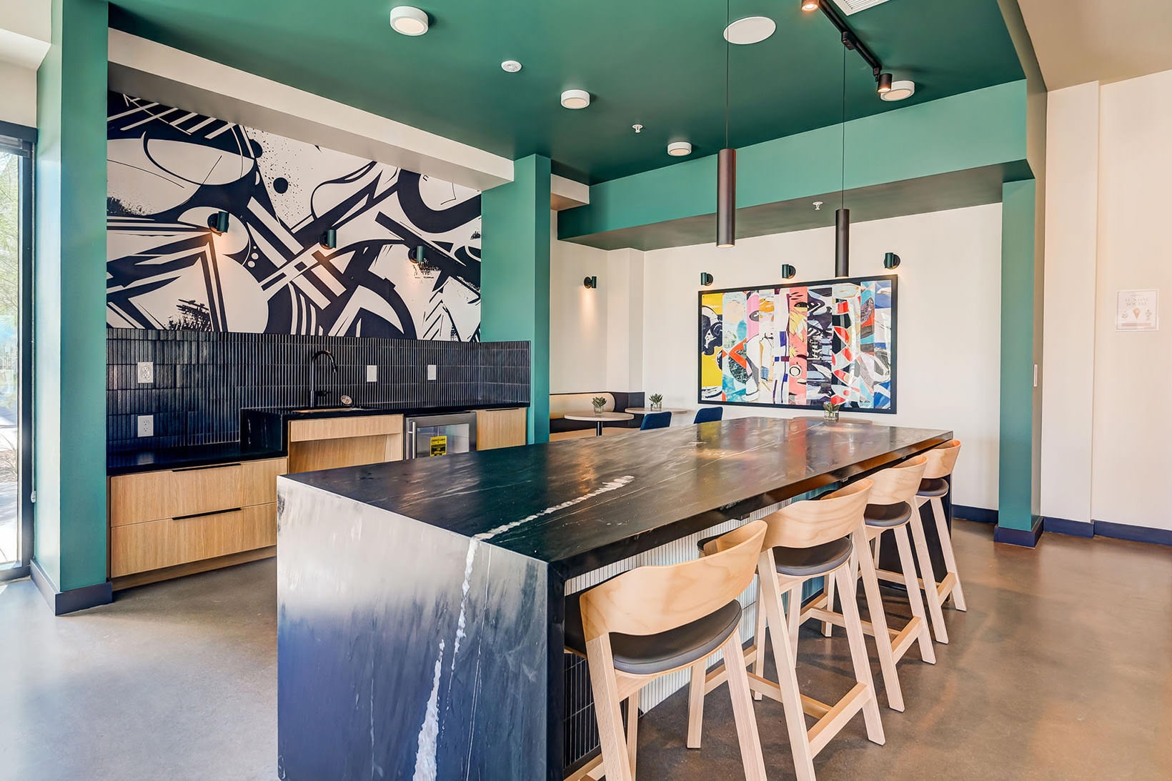 Access to resident-only features kitchen in clubhouse with island seating