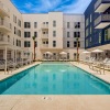 a pool with a building in the background
