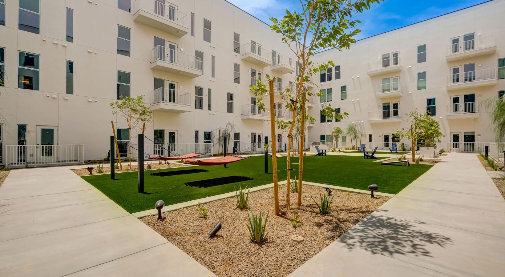 Find your perfect fit at The Pomeroy a courtyard with trees and buildings in the background