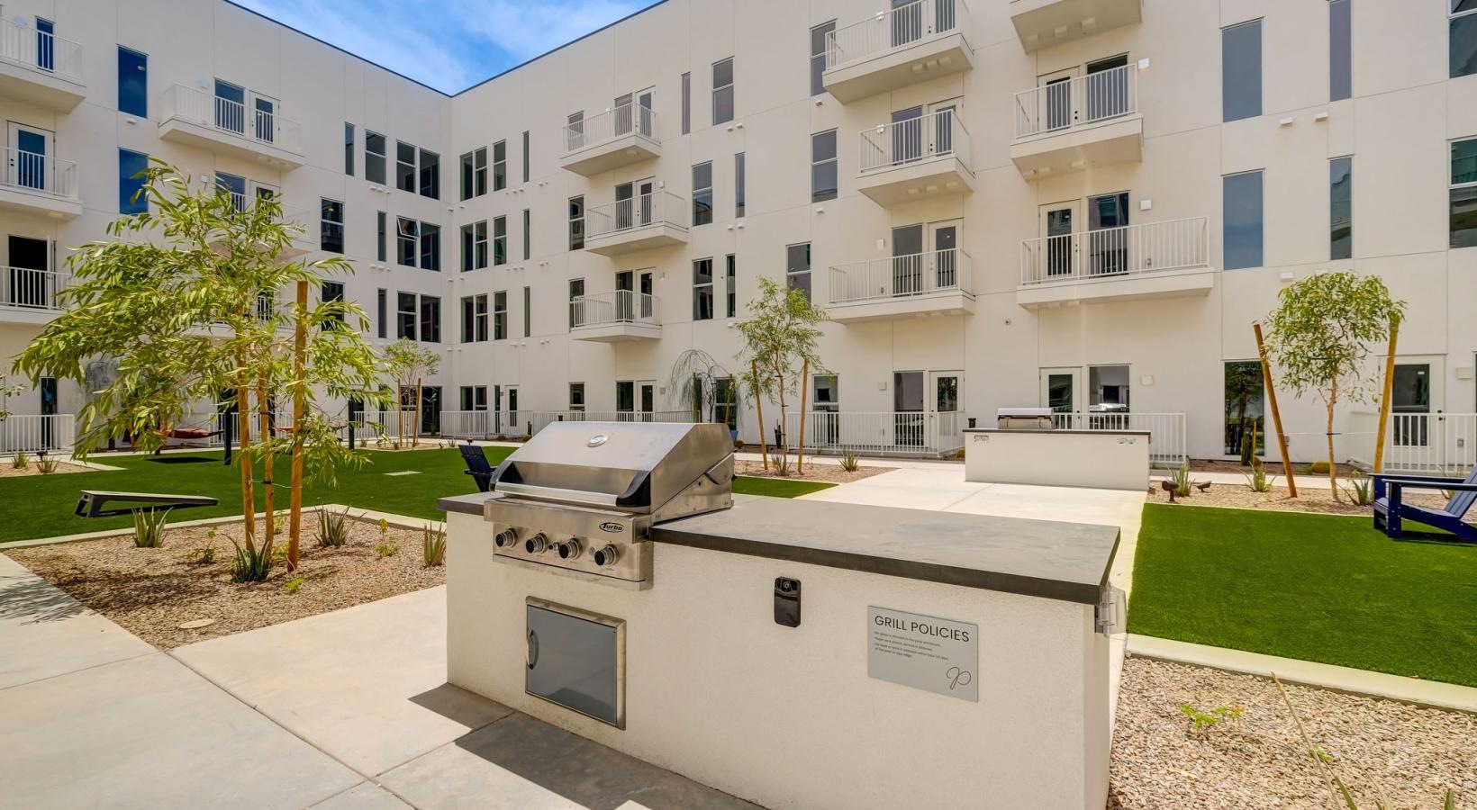 The essence of exceptional living a courtyard with trees and a grill