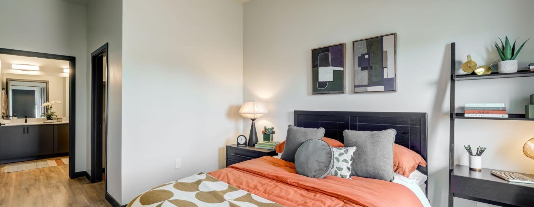 a bed with cushions inside an apartment in Mesa