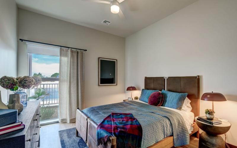 a bedroom with a large window