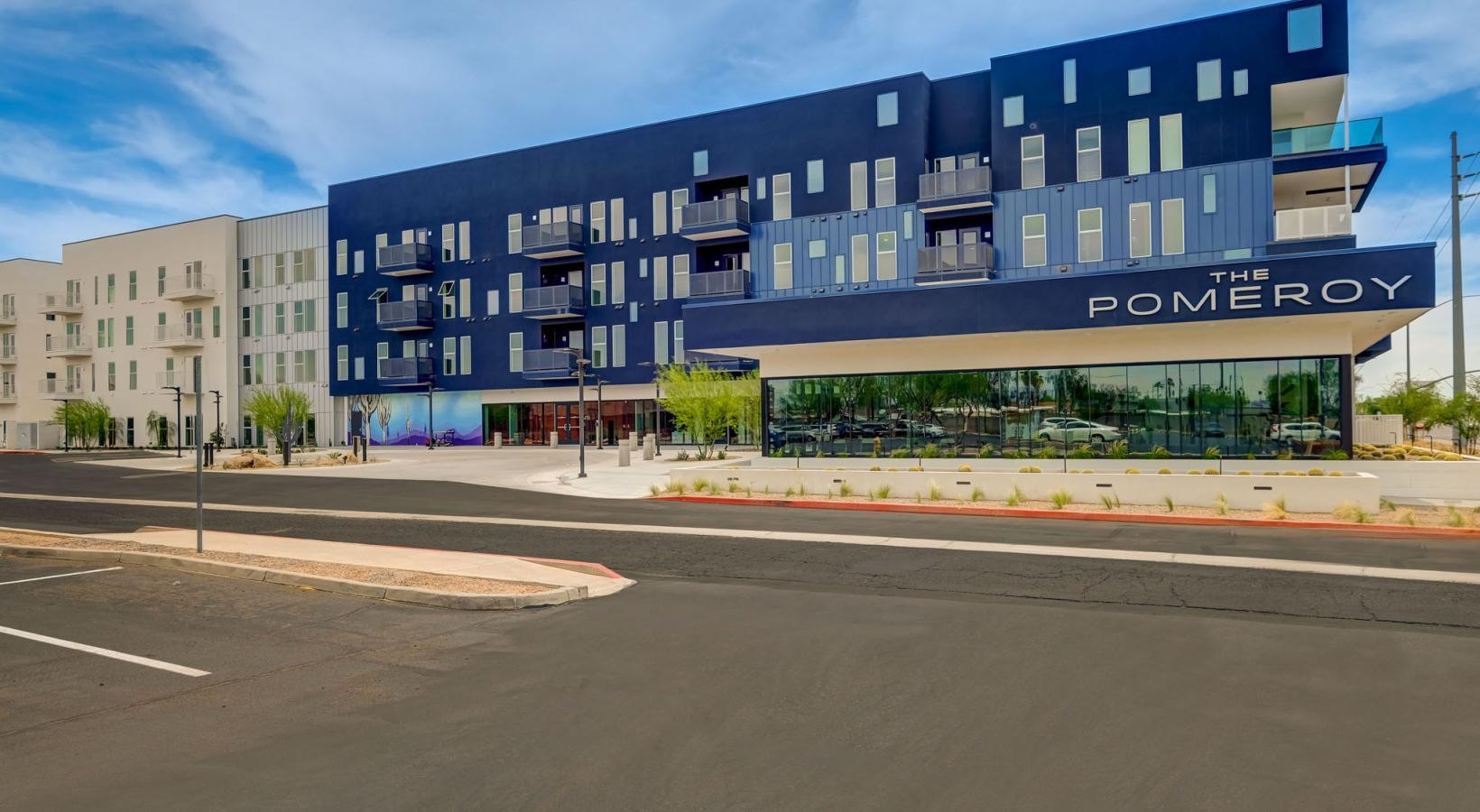 Find your perfect fit at The Pomeroy a large building with a parking lot