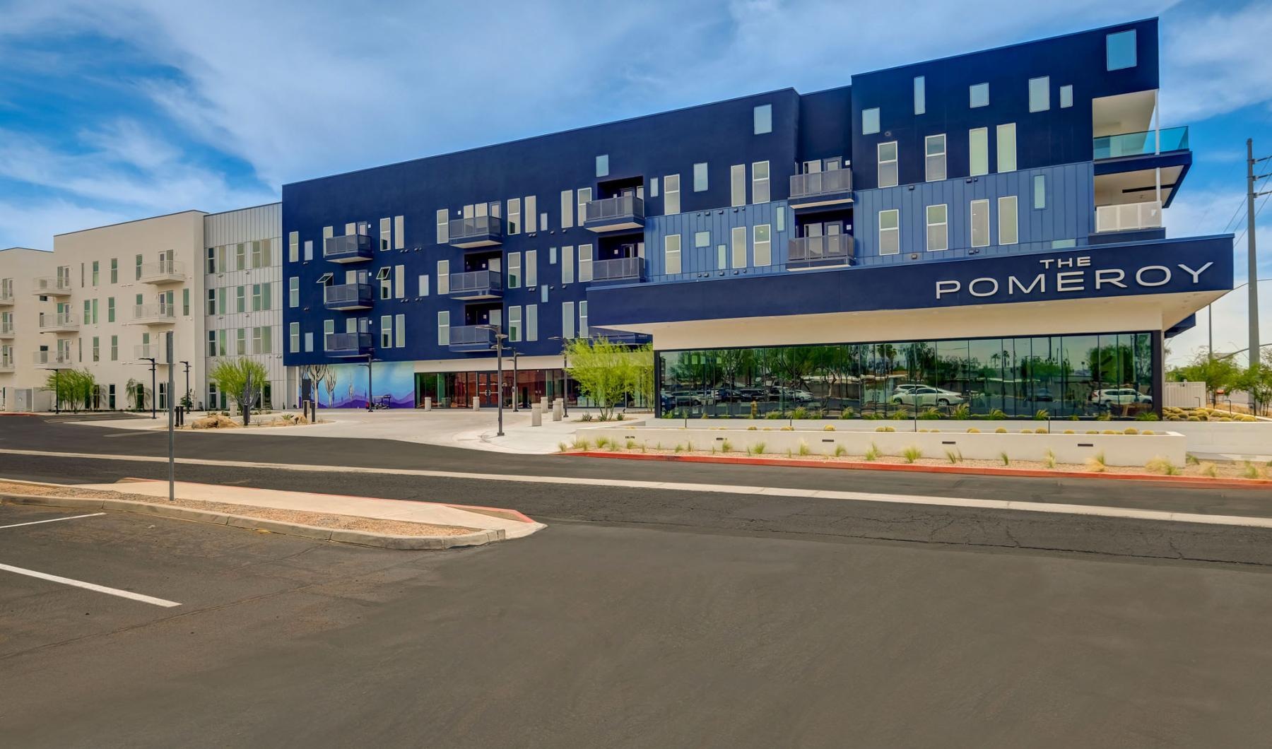 a large building with a parking lot