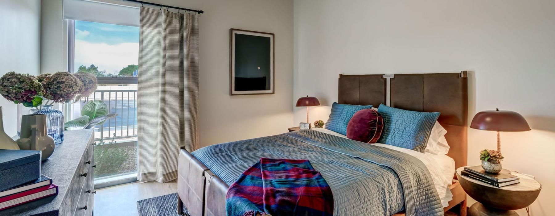 a bedroom with a large window