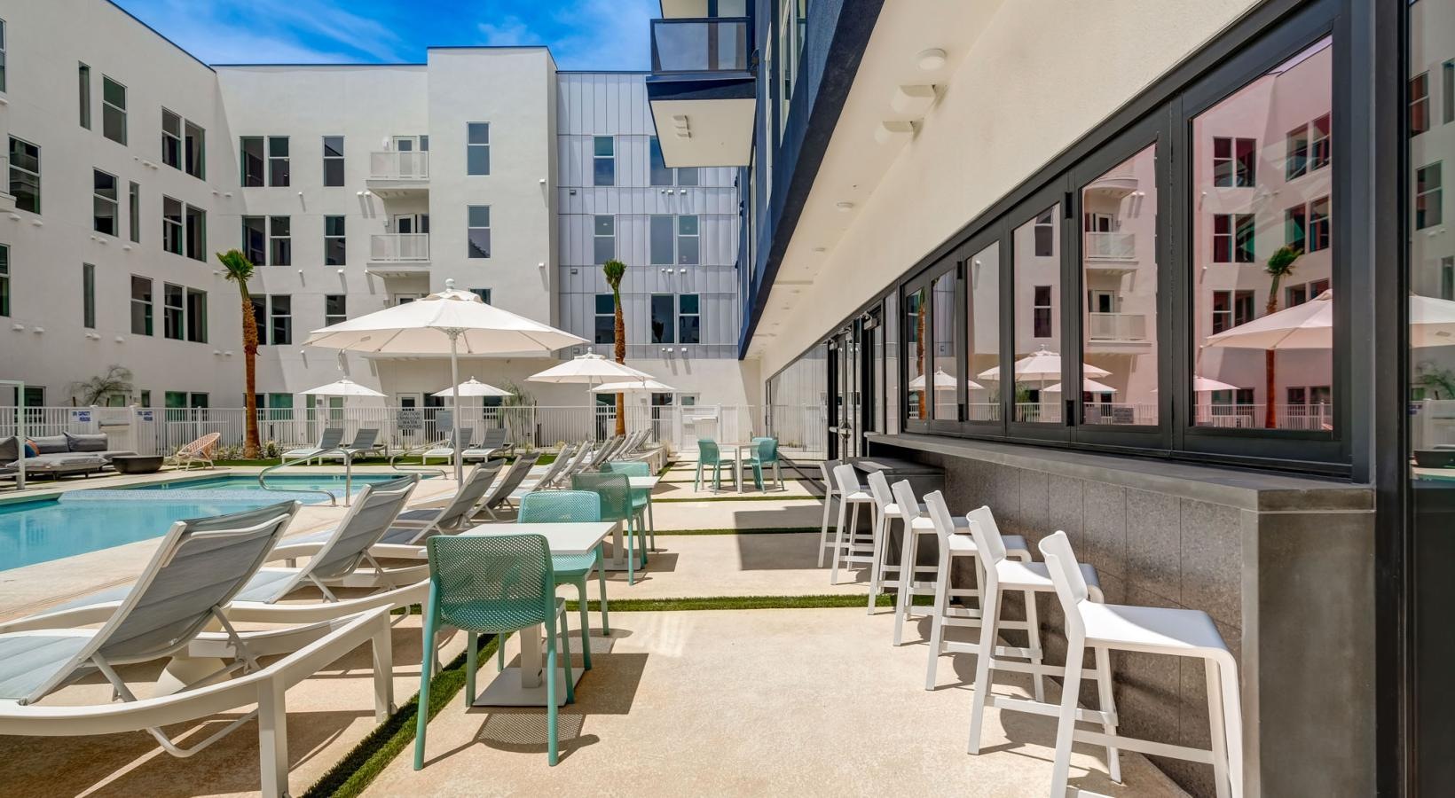 Everything within reach a patio with tables and chairs