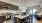 a kitchen with a bar and chairs