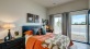 a bedroom with a large window